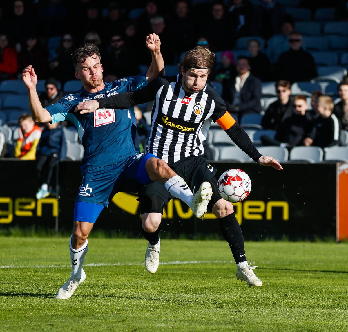 Soccer players in action during a game.