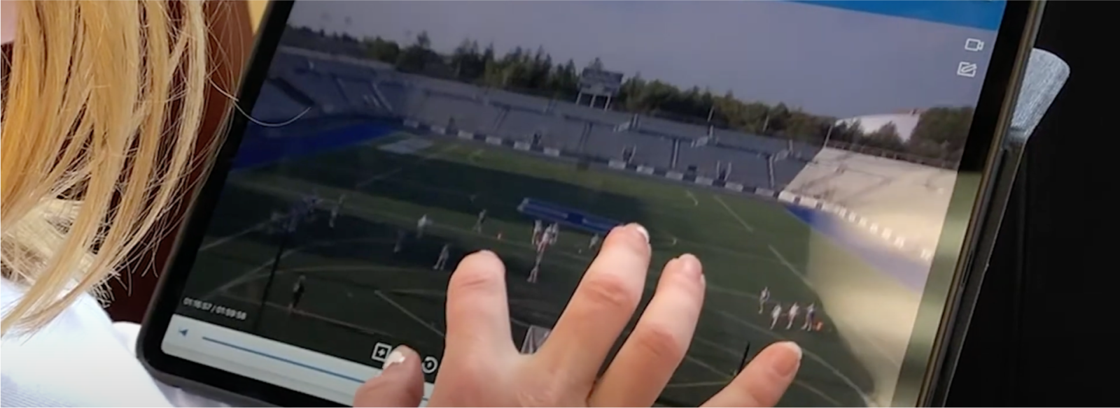 A lacrosse coach tagging live on an iPad during a game